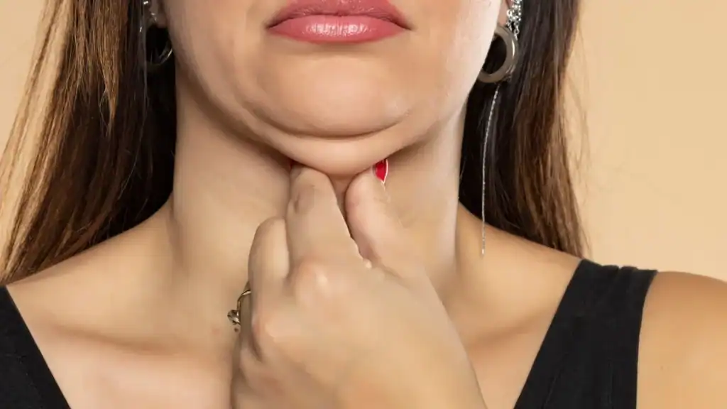 An image of a woman with double chin, sad, worried : Non Surgical Double Chin Removal Treatment in Tilehurst, UK