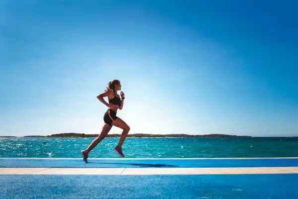 Woman running showing strong leg muscle Tilehurst